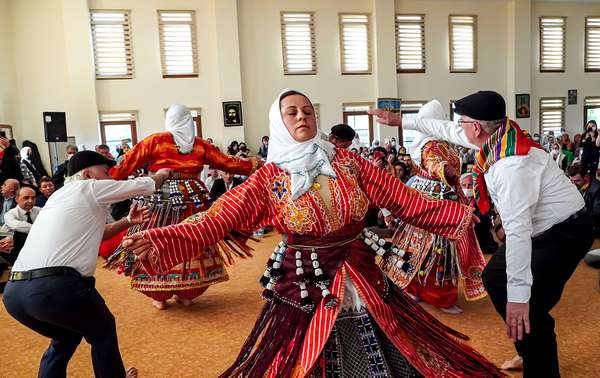 Anatolian Alevi Muslims perform Semah at a Djemevi (cem house or cemevi) to celebrate Newroz -the arrival of spring - the "Rite of Unity". They pray together in this special mass officiated by religious Alevi leader "Dede", performed dhikr and performed Semah - a religious dance, in Ismir, Turkey, March 26, 2022