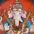 Ganesha. Hinduism. Ganesha, the elephant-headed Hindu god of beginnings, figure on external walls of a South Indian Temple in Kerala, India.