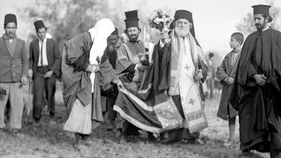 Greek Orthodox Epiphany ceremony processes to the River Jordan, celebrating Jesus Christ's baptism in the Jordan River, 1937. Christian church festival celebrated on January 6. The Three Magi, The Three Kings, The Three Wise Men