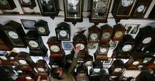 Horologist Roman Piekarski starts the time consuming task of adjusting the 600 antique clocks at Cuckooland Museum in readiness for this weekends change to British summer time on March 23, 2009 in Knutsford, England.