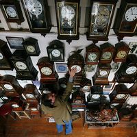 Horologist Roman Piekarski starts the time consuming task of adjusting the 600 antique clocks at Cuckooland Museum in readiness for this weekends change to British summer time on March 23, 2009 in Knutsford, England.