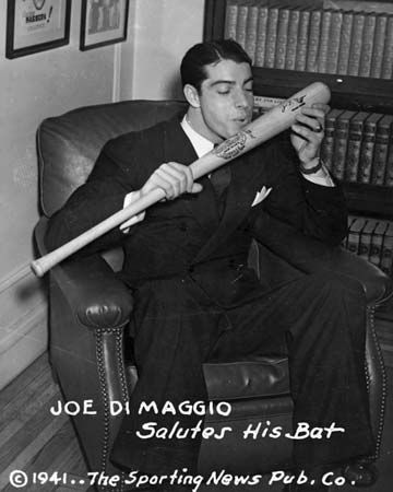 Joe DiMaggio about to kiss his baseball bat, 1941.