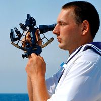 Sextant. Celestial navigation at sea. Sailor using sextant. Travel and navigation.