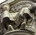 Sculpture of woman before restoration (left) and after restoration on the exterior of an office building in Palencia, Spain. (art restoration)