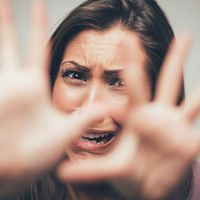 Woman expressing a scared, terrified emotion