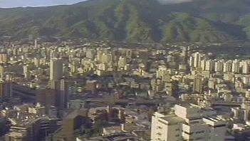 View Caracas, one of South America's principal cities, and learn about challenges it faced in the 1990s