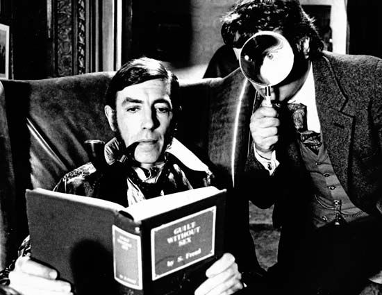 Peter Cook (left) as Sherlock Holmes and Dudley Moore as Dr. Watson in a publicity shot for the 1978 film version of Arthur Conan Doyle's The Hound of the Baskervilles.