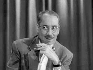 Watch an episode of the television game show “You Bet Your Life” hosted by Groucho Marx