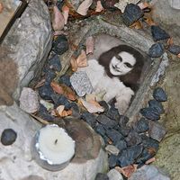 Anne Frank. Photo of Anne Frank at the children's memorial at the Okopowa Street Jewish Cemetery in Warsaw, Poland Nov. 8, 2008. Anne Frank was a Jewish wartime girl diarist who hid from the Nazis during World War II. WWII, Holocaust