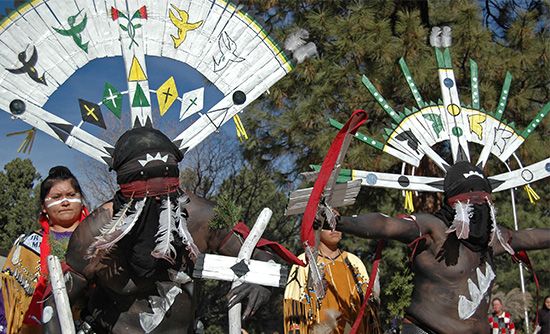 Apache men performing the dance of Gahan