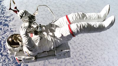 Above the clouds 130 nautical miles below, astronaut Mark C. Lee floats freely without tethers as he tests the new Simplified Aid for Extravehicular Activity (EVA) Spacewalk Rescue (SAFER) system, Sept. 16, 1994. Space Shuttle Discovery, STS-64