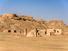 Towers of silence in a barren desert under clear blue skies. A Dakhma, also known as the Tower of Silence, is a circular, raised structure built by Zoroastrians for excarnation