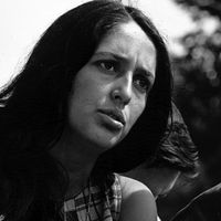 American singer and political activist Joan Baez performing at the Civil Rights March on Washington, D.C., August 28, 1963. Photo by Rowland Scherman. See Content Notes.