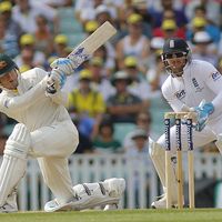 Michael Clarke plays a shot as Matt Prior looks on during the Investec Ashes cricket match between England and Australia played at The Kia Oval Cricket