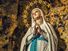 The apparition of the Blessed Virgin Mary surrounded by stars in the grotto of Lourdes