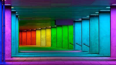 Colorful mulitcolord illuminated gallery tunnel rainbow passage under NAI building, Netherlands Architecture Institute near Museum Park, Rotterdam, The Netherlands