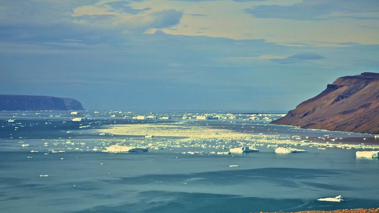 Join a climate-change research team collecting samples from the bottom of Greenland's Arctic lakes