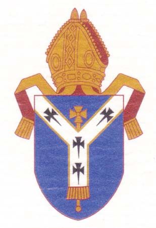 Arms of the see of Canterbury. The shield depicts a pallium, the white woolen garment that signifies the authority of the pope; the arms predate the break between the Church of England and the Roman Catholic church.