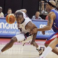 United States' Kobe Bryant, left, drives past Puerto Rico's Elias Ayuso during in the third quarter of their FIBA Americas Championship basketball game at the Thomas & Mack Center in Las Vegas, Saturday, Sept. 1, 2007