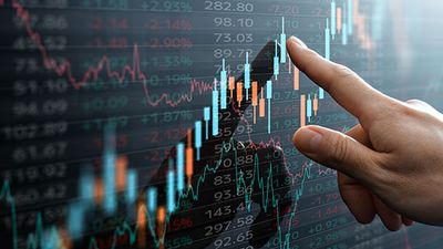 Financial candlestick chart on touchscreen.