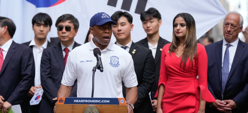 Assembly Member Jenifer Rajkumar looks on as Mayor Eric Adams speaks at a flag-raising ceremony for the Republic of Korea on Aug. 14.