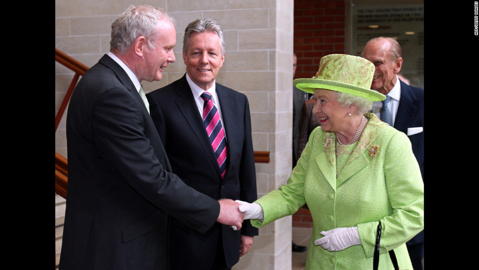 An historic moment was made when &lt;a href=&quot;http://edition.cnn.com/2012/06/26/world/europe/northern-ireland-mcguinness-queen-handshake/&quot;&gt;Queen Elizabeth II&lt;/a&gt; shook  hands with Northern Ireland Deputy First Minister Martin McGuinness as First Minister Peter Robinson looks on at the Lyric Theatre in Belfast, Northern Ireland, on June 27, 2012. A simple handshake marks a step forward in the peace process relating to British rule of Northern Ireland. 