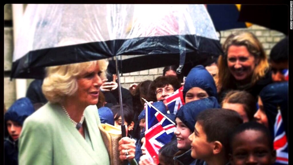 Camilla speaks with children greeting her outside the headquarters of la Garde Républicaine -- the Republican Guard.