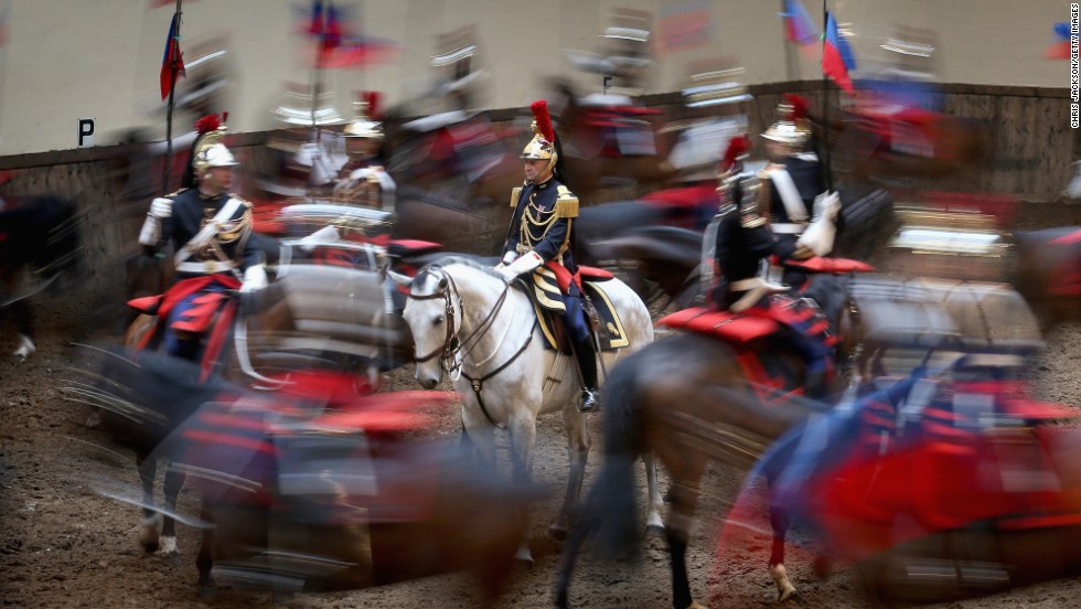 Members of la Garde républicaine perform for Camilla at their headquarters.