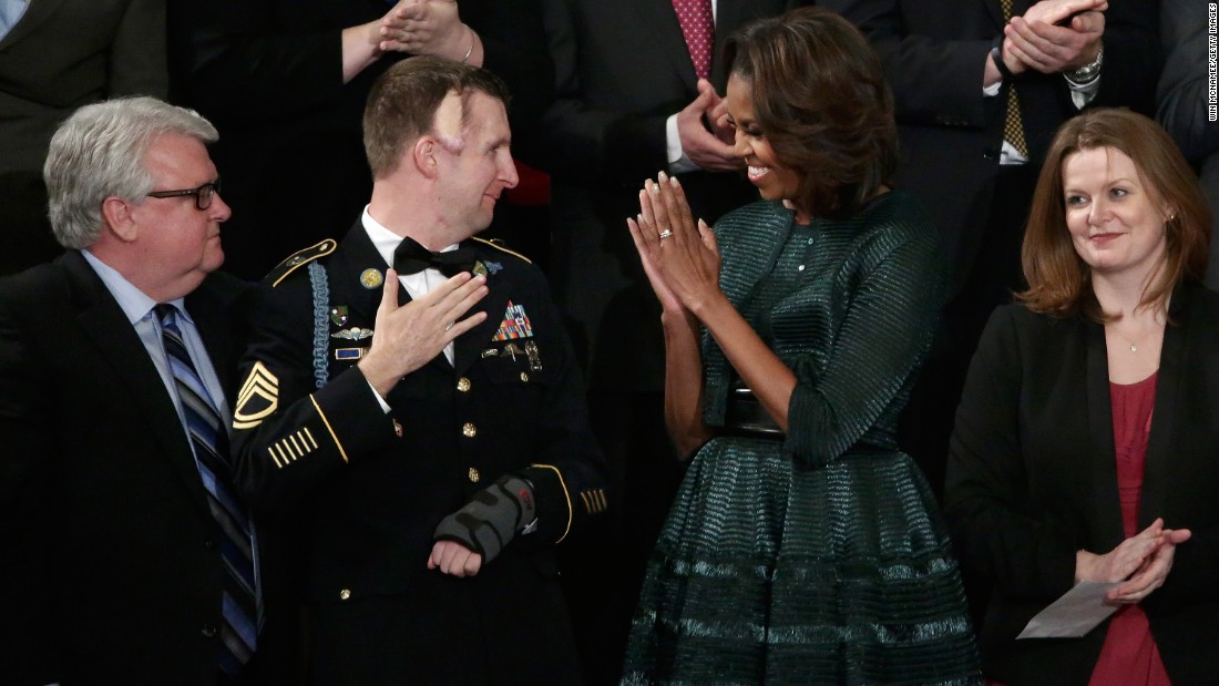 Obama wore &lt;a href=&quot;http://www.huffingtonpost.com/2014/01/28/michelle-obama-state-of-the-union-dress-2014_n_4676593.html&quot; target=&quot;_blank&quot;&gt;this forest green Azzedine Alaia ensemble&lt;/a&gt; -- which included a full-skirted dress, an oversized belt and a cropped jacket -- for the State of the Union address on January 28, 2014.