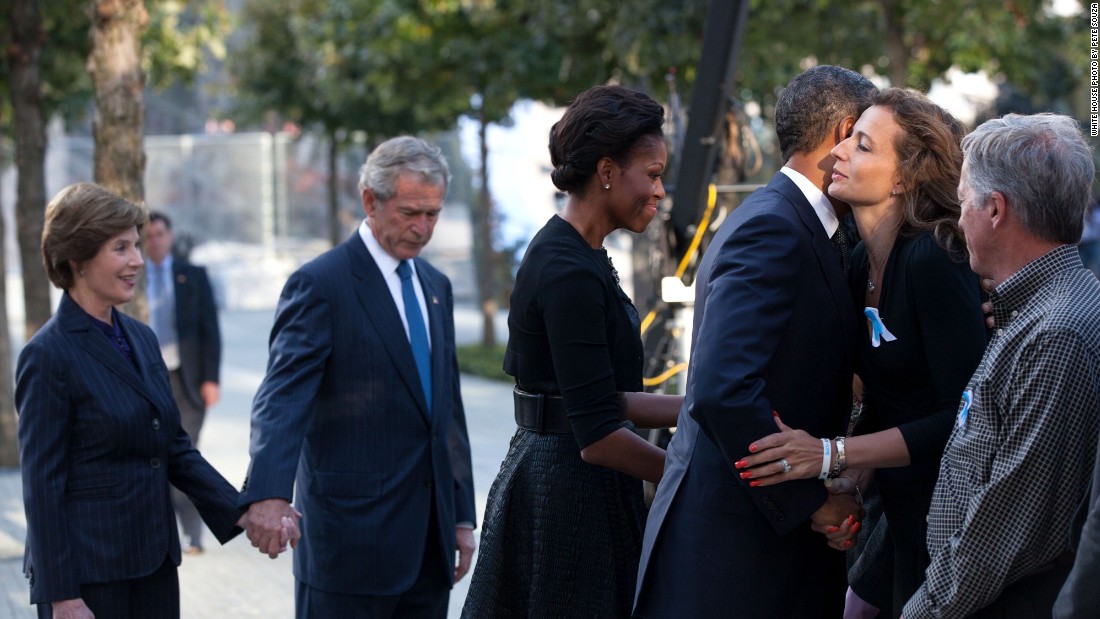 Greeting families with former first lady Laura Bush (from left), former President George W. Bush and first lady Michelle Obama before a commemoration ceremony on the 10th anniversary of the 9/11 terrorist attacks in New York on September 11, 2011. 