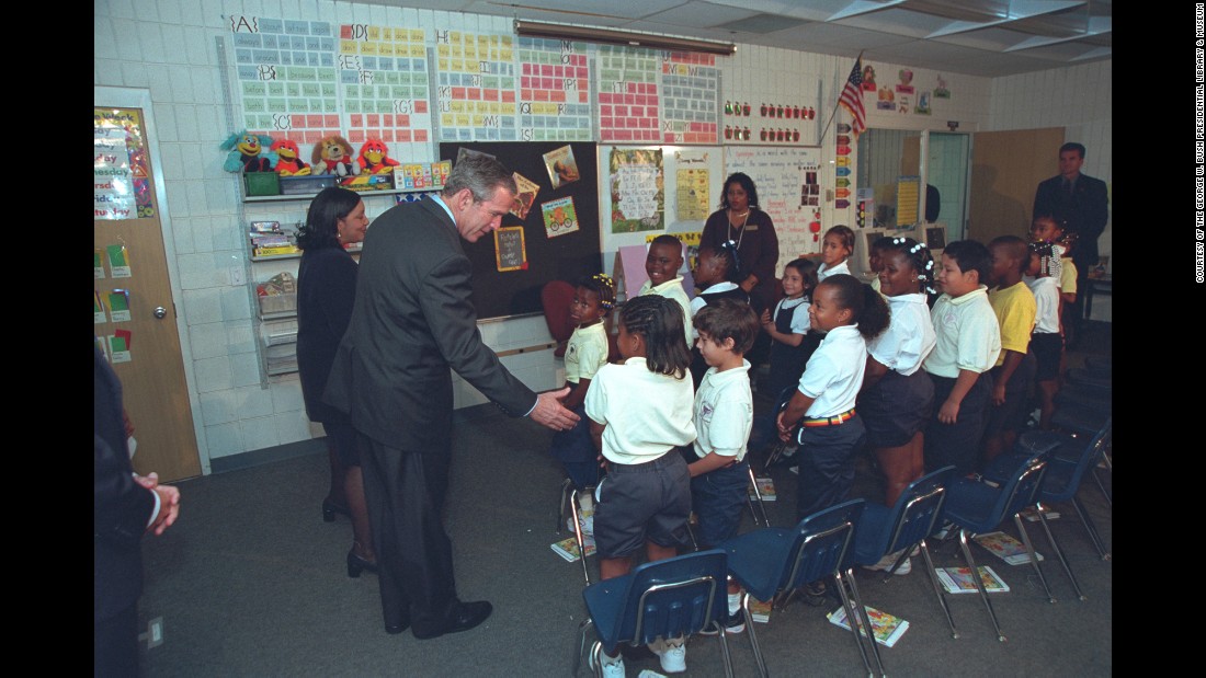 U.S. President George W. Bush greets students as he visits an elementary school in Sarasota, Florida, on September 11, 2001. It was here where Bush first learned of the terrorist attacks against the United States. These photos, taken by former White House photographer Eric Draper, were recently released by the George W. Bush Presidential Library and Museum.