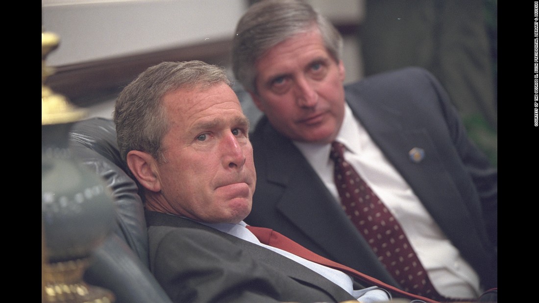 Bush and White House Chief of Staff Andrew Card talk privately after arriving at Barksdale Air Force Base.