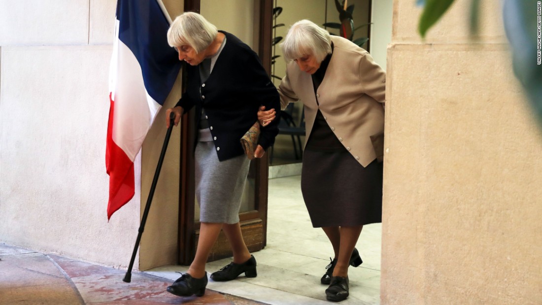 Twin sisters leave a polling station in Nice, France after voting on May 7 in the second round of the French presidential election. 