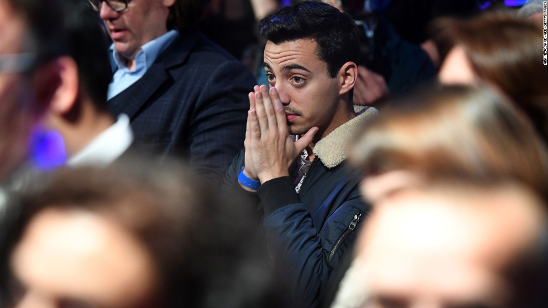 Le Pen supporters react to the election results in Paris on May 7.