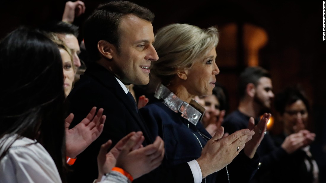 French President-elect Emmanuel Macron stands with his wife Brigitte Trogneux in front of the Pyramid at the Louvre Museum in Paris on Sunday, May 7, 2017, after the second round of the French presidential election. Macron soundly defeated far-right candidate Marine Le Pen.