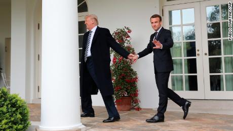 President Donald Trump and French President Emmanuel Macron walk to the Oval Office on April 24.