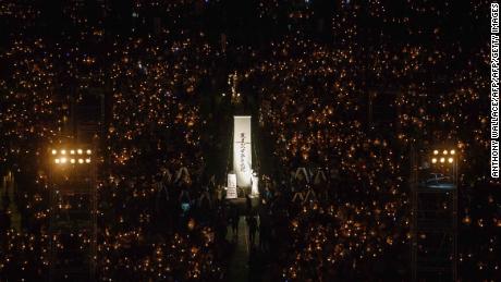 People hold candles during a vigil in Hong Kong on June 4, 2018, to mark the 29th anniversary of the 1989 Tiananmen crackdown in Beijing. 