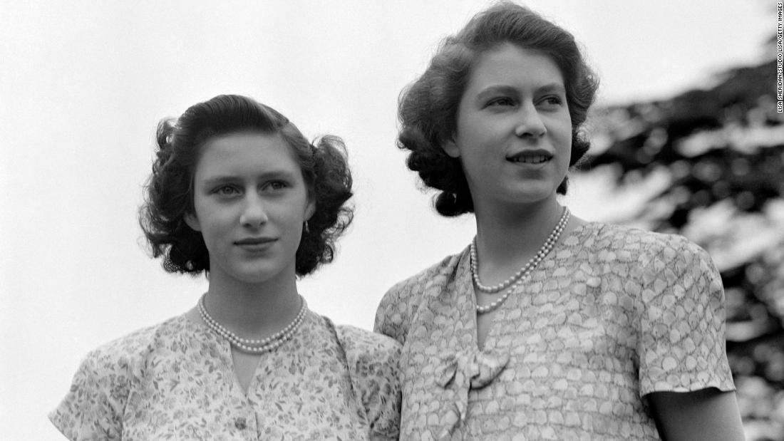 Elizabeth, right, and Princess Margaret wear summer dresses circa 1942. Margaret was Elizabeth&#39;s only sibling.