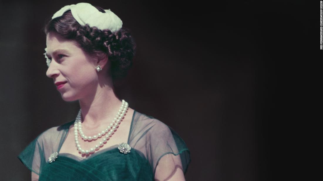 Queen Elizabeth II is photographed on the balcony of Melbourne&#39;s Government House during her tour of Australia in March 1954.