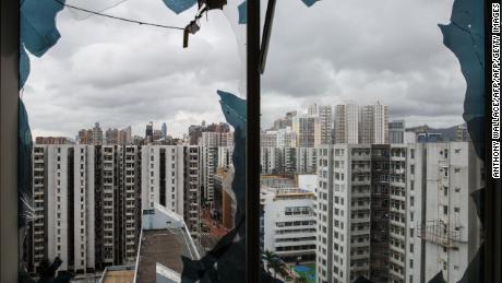 A general view is seen from a company office, in a harbourside commercial building, whose windows were blown out the day before during Typhoon Mangkhut in Hong Kong on September 17, 2018. - Hong Kong began a massive clean-up on September 17 after Typhoon Mangkhut raked the city, shredding trees and bringing damaging floods, in a trail of destruction that left dozens dead in the Philippines and millions evacuated in southern China. (Photo by Anthony WALLACE / AFP)        (Photo credit should read ANTHONY WALLACE/AFP/Getty Images)