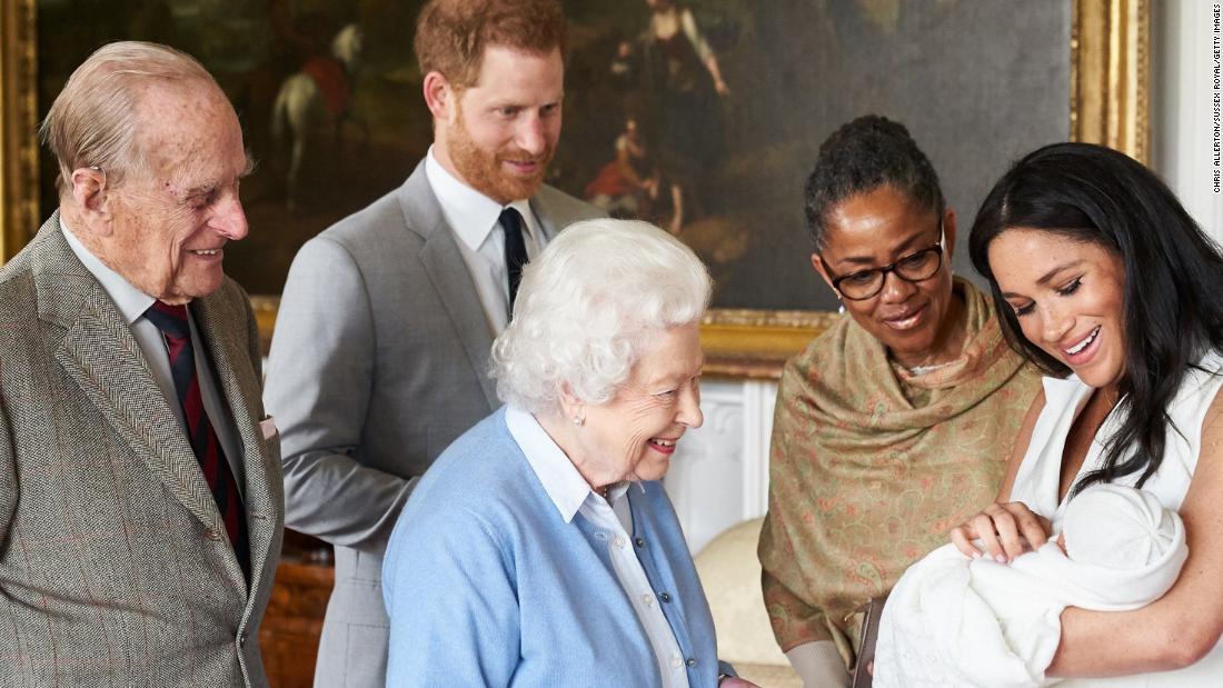 The Queen looks at &lt;a href=&quot;http://www.cnn.com/2019/05/08/uk/gallery/archie-royal-baby-harry-meghan/index.html&quot; target=&quot;_blank&quot;&gt;her new great-grandchild, Archie,&lt;/a&gt; in May 2019. Archie is the first child of Prince Harry, second from left, and his wife Meghan, the Duchess of Sussex. Prince Philip is on the far left. Meghan&#39;s mother, Doria Ragland, is next to her at right.