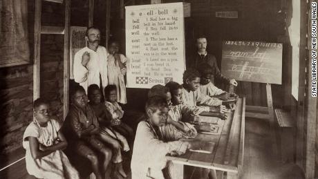 Indigenous children are seen at a Church of England mission school in Yarrabah, north Queensland, in 1893. Indigenous students were often forced to learn English and forbidden from speaking their own languages. 