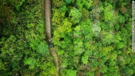 TOPSHOT - Hikers walk the Ngong Ping 360 Rescue Trail on Hong Kong&#39;s outlying Lantau Island on February 23, 2018. / AFP PHOTO / ANTHONY WALLACE        (Photo credit should read ANTHONY WALLACE/AFP via Getty Images)