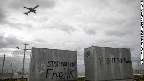 HONG KONG, CHINA - SEPTEMBER 01: Free HK graffiti is seen as a plane takes off from Hong Kong International Airport on September 1, 2019 in Hong Kong, China. Pro-democracy protesters have continued rallies on the streets of Hong Kong against a controversial extradition bill since 9 June as the city plunged into crisis after waves of demonstrations and several violent clashes. Hong Kong&#39;s Chief Executive Carrie Lam apologized for introducing the bill and declared it &quot;dead&quot;, however protesters have continued to draw large crowds with demands for Lam&#39;s resignation and completely withdraw the bill.  (Photo by Chris McGrath/Getty Images)