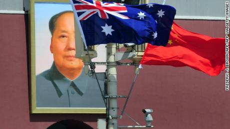 The national flags of Australia and China are displayed before a portrait of Mao Zedong facing Tiananmen Square, during a visit by Australia&#39;s Prime Minister Julia Gillard in Beijing on April 26, 2011. The trip is Gillard&#39;s first to China, Australia&#39;s top trading partner, and comes at a time when the communist country is waging its toughest crackdown on dissent in years. AFP PHOTO/Frederic J. BROWN (Photo credit should read FREDERIC J. BROWN/AFP via Getty Images)