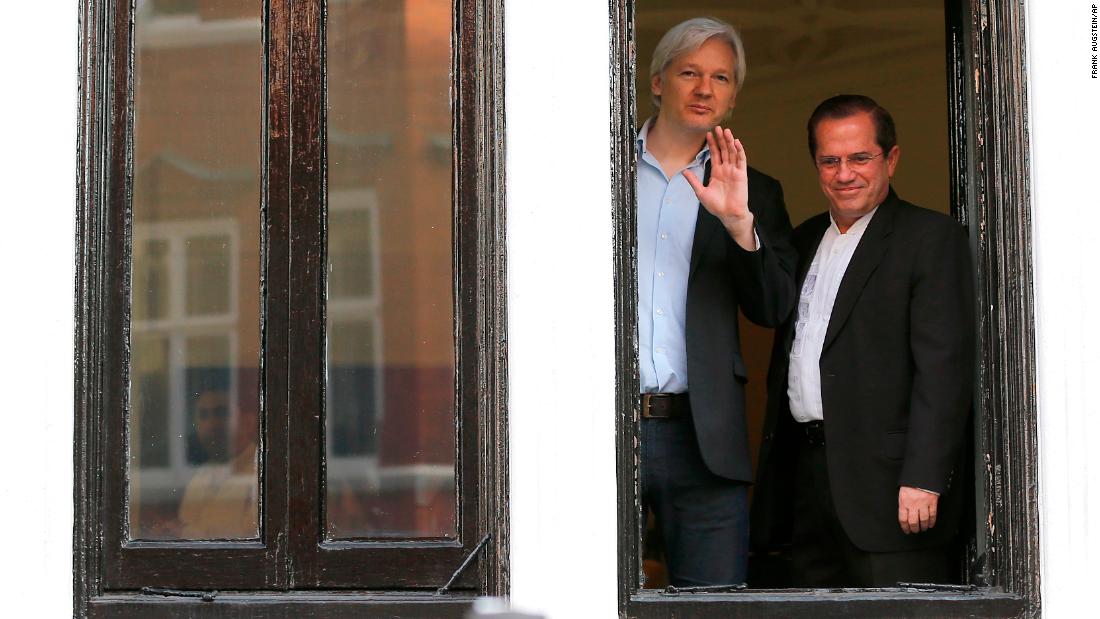 Assange appears with Ecuadorian Foreign Minister Ricardo Patino on the balcony of the embassy in June 2013.