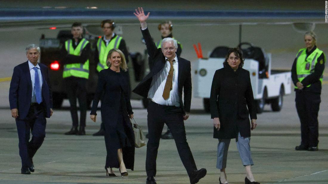 WikiLeaks founder Julian Assange waves as he arrives in Australia on June 26.