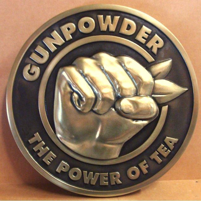 M7155 - Brass Wall Plaque, "Gunpowder - The Power of Tea", with Clinched Fist