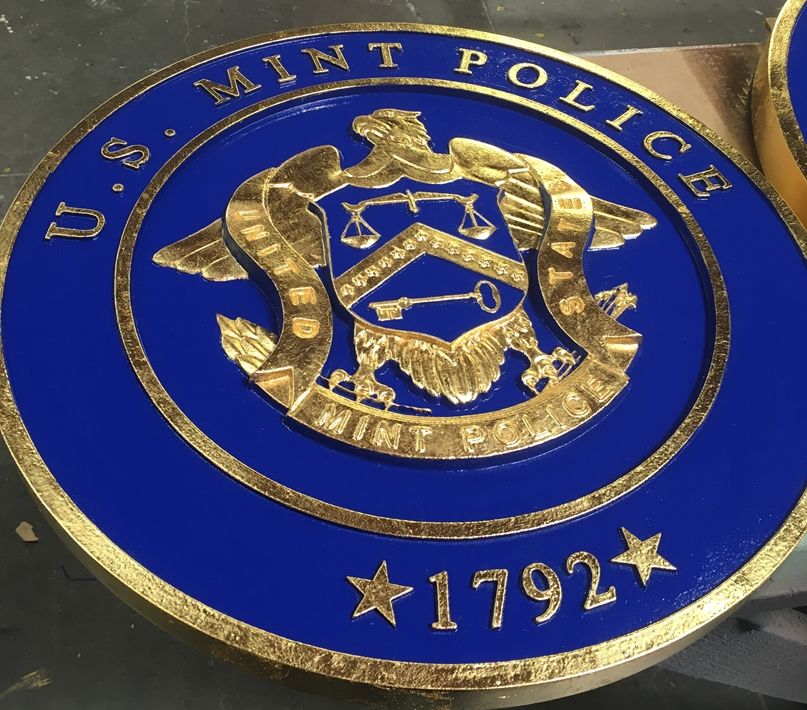 M7328  - Gold-Leaf Gilded  Plaque of  the Seal of the US Mint Police,  with Blue Painted Background