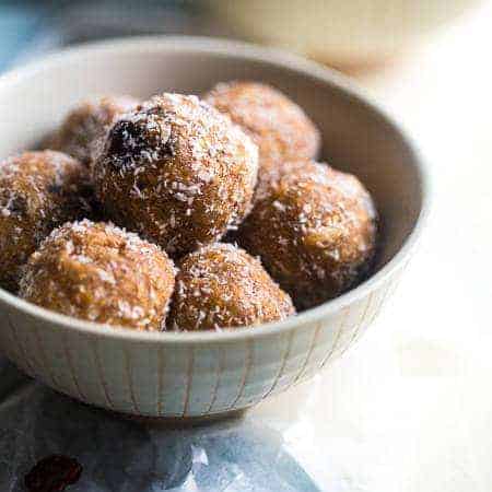 Paleo Coconut Rum Raisin Energy Balls - A quick and easy snack that are ready in only 10 minutes! A healthy, high protein and gluten free taste of the tropics to give you an energy boost! | Foodfaithfitness.com | @FoodFaithFit